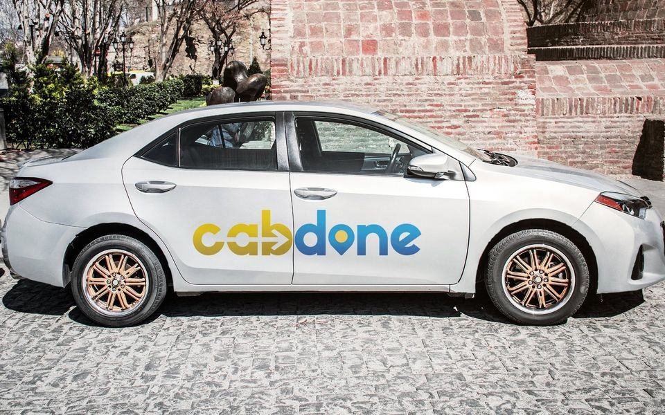 Cabdone brand identity on a car